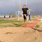 Lonnie Kamacho, junior, practices his form for the long jump.