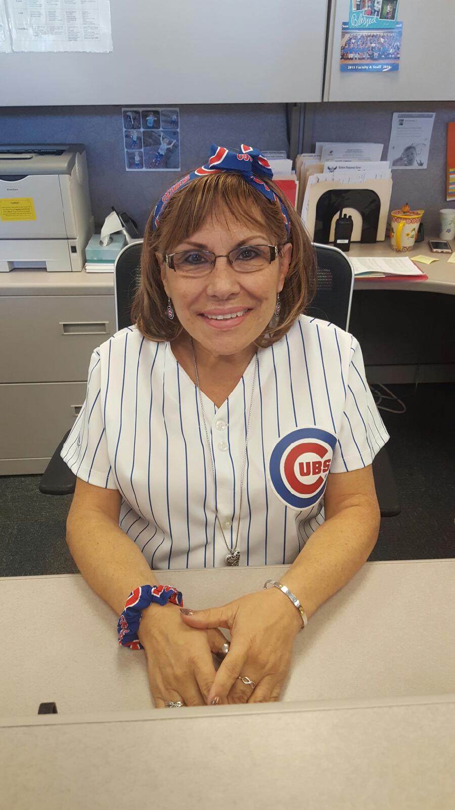 Rosa Leptich, conduct secretary, dresses up in her Cubs gear before game six, to root for her favorite team.