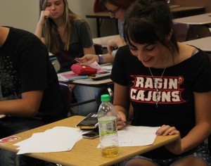 PHOTO BY BRYCE PATTERSON Kailee Clinton, senior, in precalculous diligently works on her homework during class