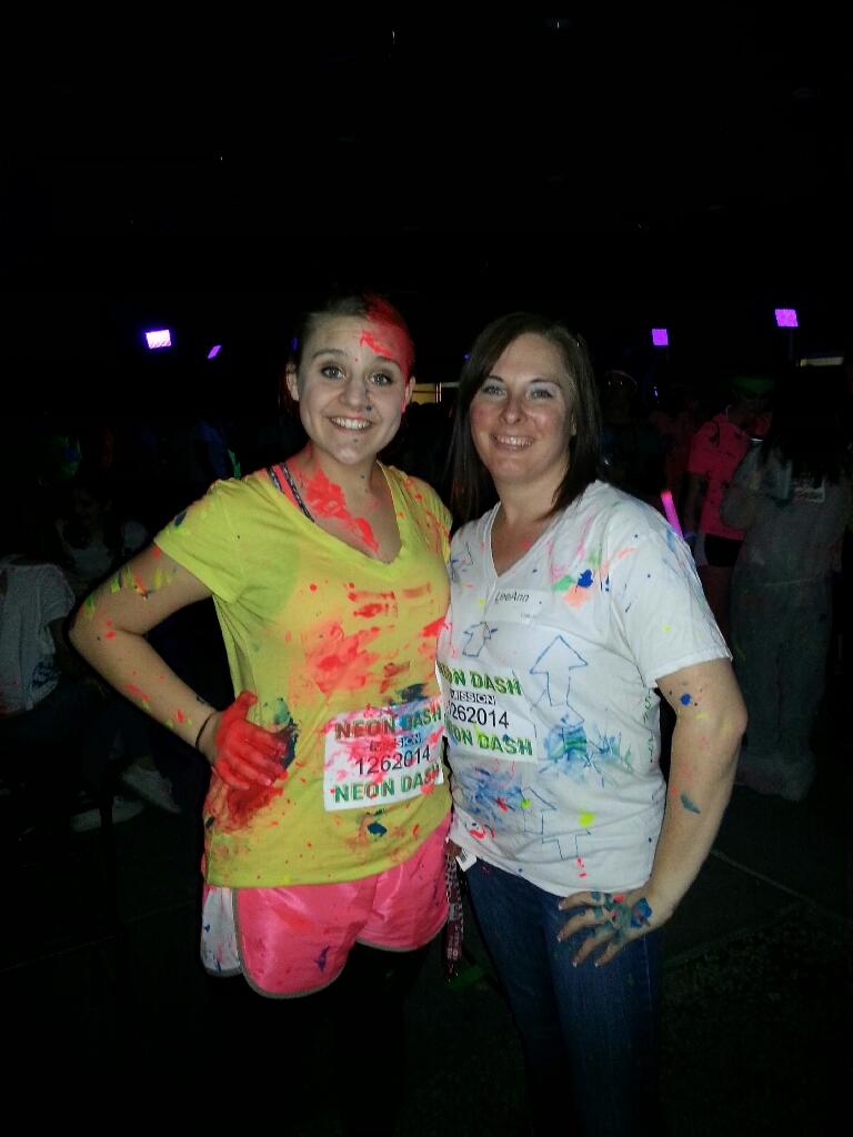 Santillo and her youth leader, LeeAnn Miller, pose after the CCV Neon Dash last month, splattered with paint.