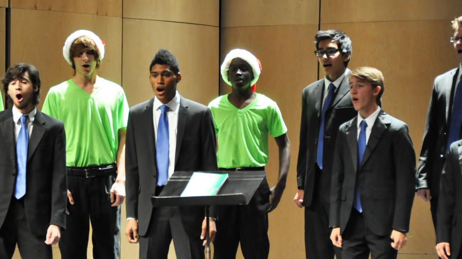 OHS choir performs holiday songs while clad in Santa hats or a suit and tie. 