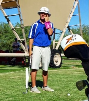 Aaron Prado, senior, wears his floatie on the golf course as he prepares for a possible assassination from another opposing team