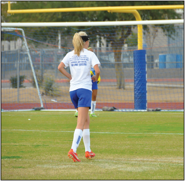 Savannah Tidd, senior varsity player, prepares for a game by practicing hard on the OHS soccer field after school last year.