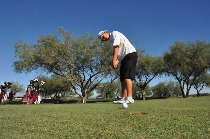 Brandon Rofles practices his swing earlier this season.