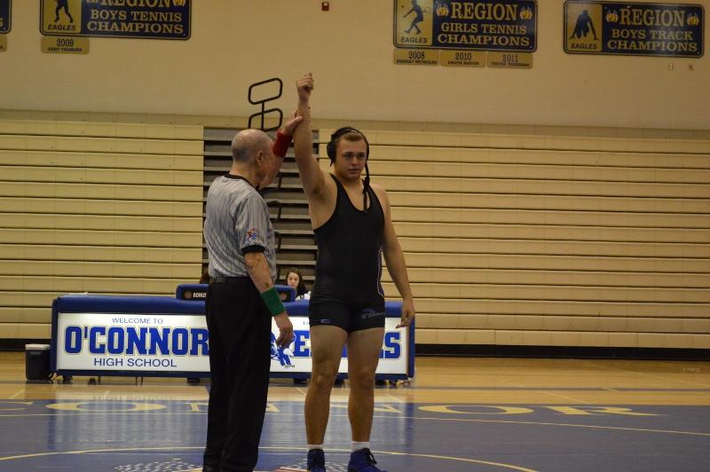 Jarom+Christensen%2C+senior%2C+is+congratulated+after+winning+a+match%2C+at+a+home+meet.+Due+to+the+date%2C+this+photo+from+last+years+wrestling+season.