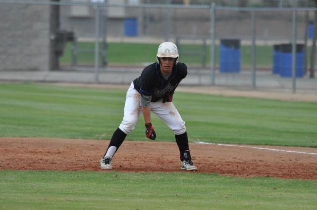 Dakota Solis, senior, stares at homeplate, ready to run quickly, as soon as his teammate hits the ball.