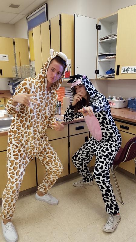 Dressed to impress, Chris Coppla, junior, and Megan Hunt, sophomore, sport animal onesies for Welcome to the Outback.