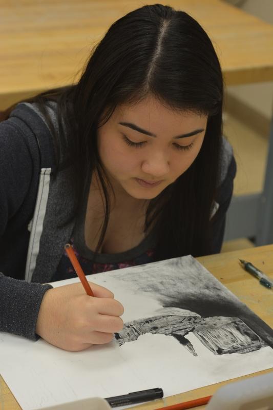 Sophia Steuber, senior, works on her art work for her AP portfolio.