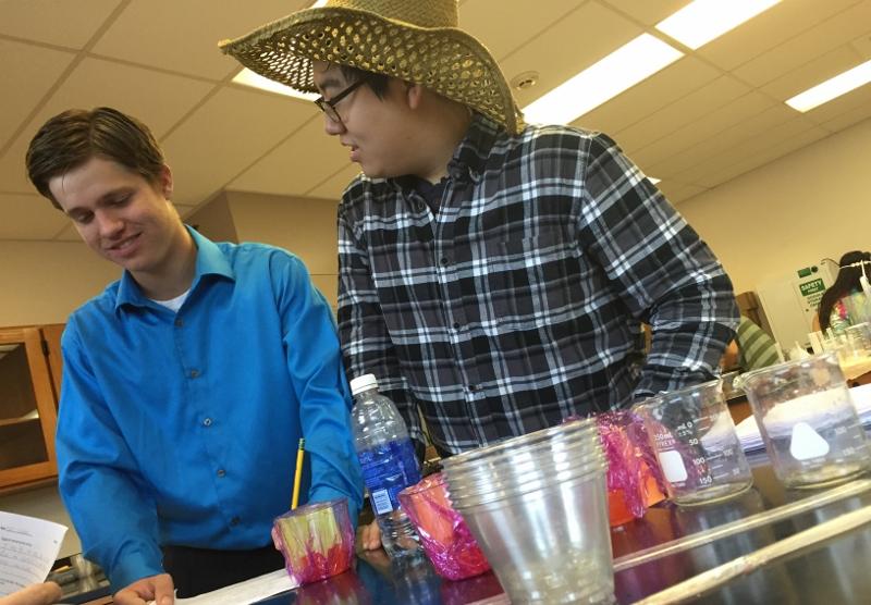 Trent  Wohrle and Jae Won Song, seniors, see two departure points collide as they complete their biology assignment.