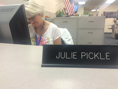Julie Pickle sits at her new desk in place of Kari Beth Paulk, due to changes in administrative staff.