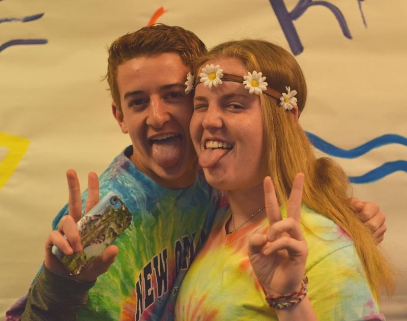 Ellie Slattery and Coltyn Roach flaunt peace signs and smiles.
