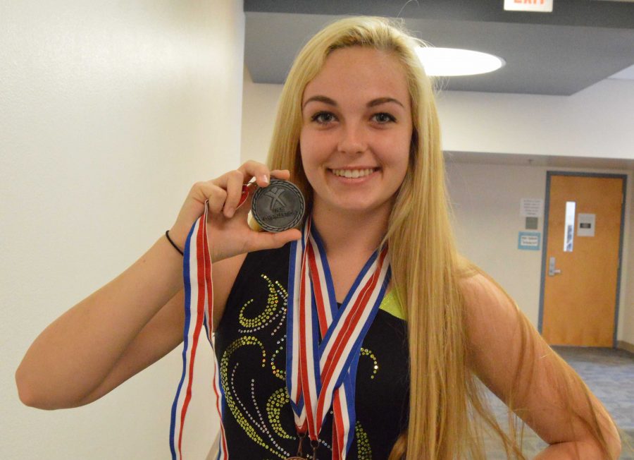 Hayden Knytych, junior, impresses people with her medals. “winning “ them as she is an olympian athlete. 