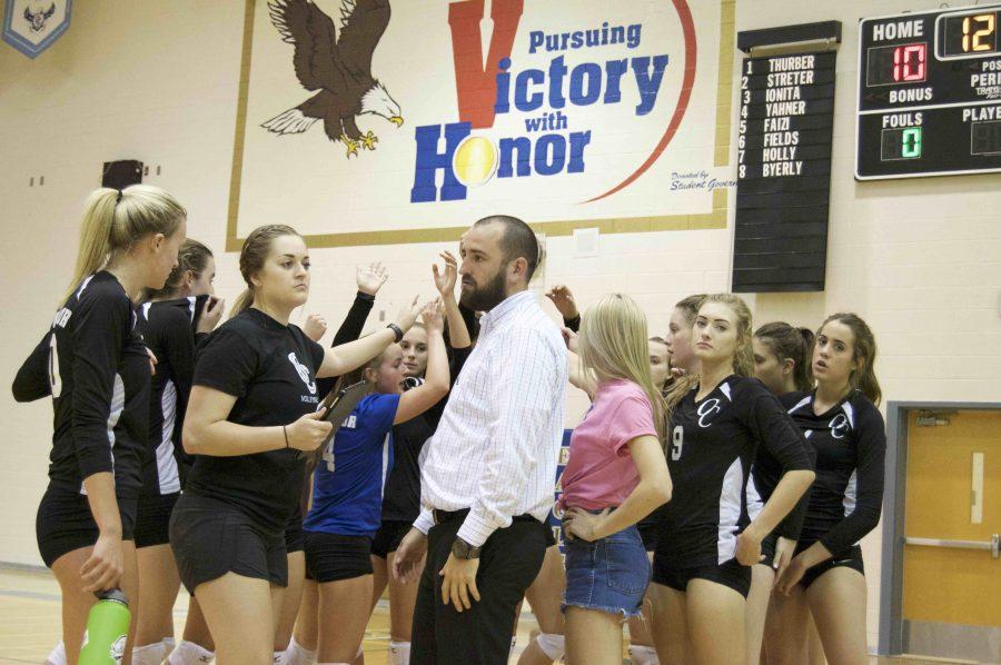 The+girls+varsity+volleyball+team+huddles+after+a+game.