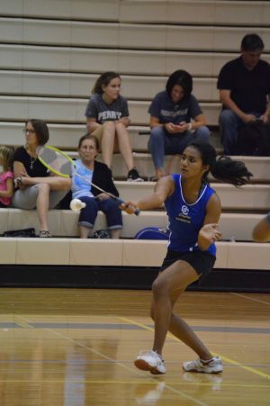 Bhavana Somayaji, senior, dropping the birdie towards her opponents side of the court leading her with 7-0 against Maryvale. 