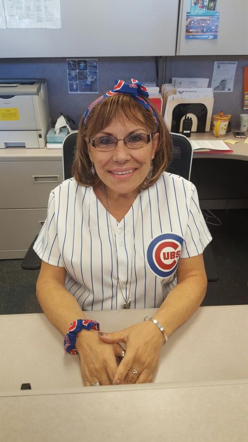 Rosa Leptich, conduct secretary, dresses up in her Cubs gear before game six, to root for her favorite team. 