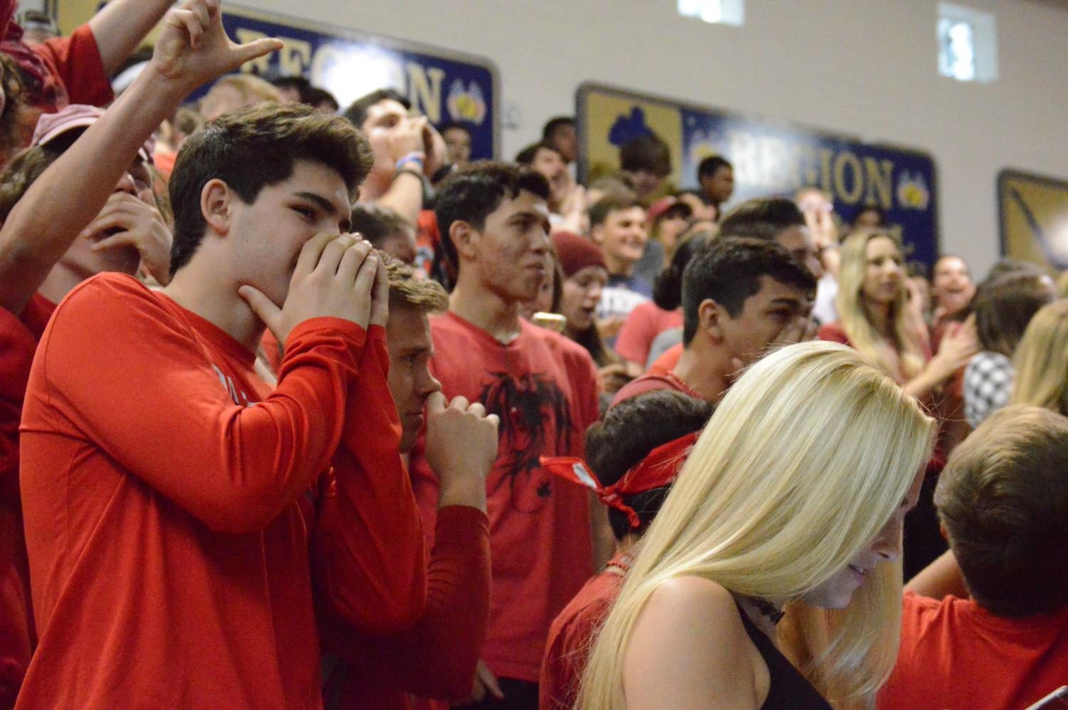 The juniors cheer at the assembly.