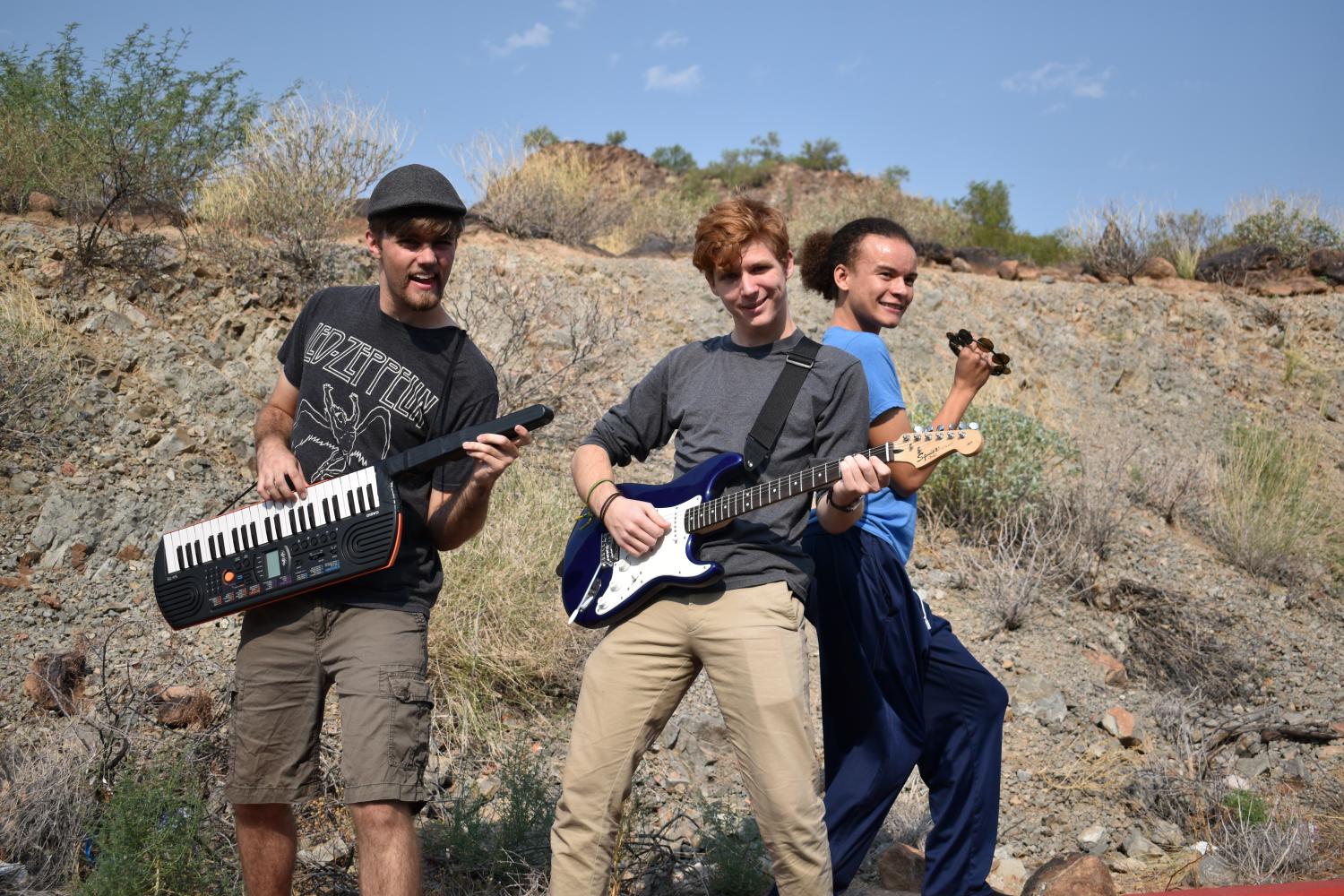 (left to right) Nick Leache, senior, Bryce Craig, senior, and One Griffin, senior, pose as the band in the play The Wedding Singer