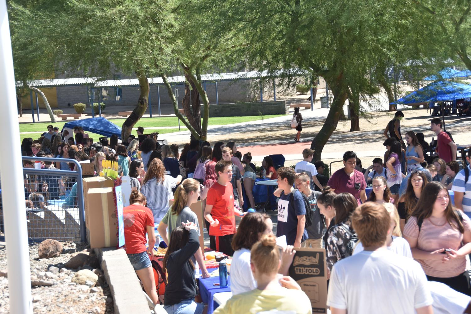 Students walk through the crowds of clubs.