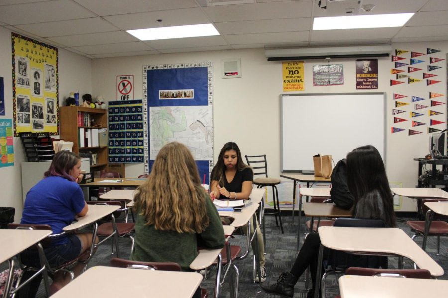 Students brainstorm creative slam poetry club ideas for future projects