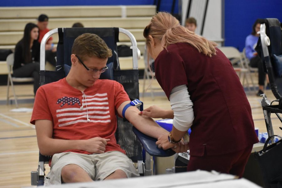 Joshua Aikens, junior, gets ready to get his blood drawn.
