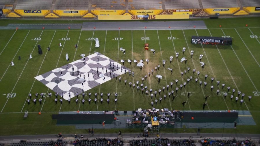 A birds-eye view of the Eagle Pride Marching Band performing their show Were All Mad Here at Superstate.