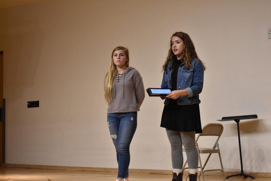 Mentors Hanna Flores, junior, and Isabella Shawe, junior, talk to the other freshmen mentors about how to help freshmen. 