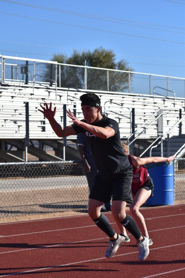 John Woods, senior, practices jumping during practice on Dec. 13. 