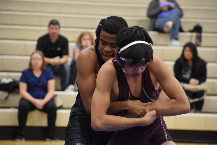 Sharkim Medlin, works on taking down his opponent from Valley Vista on Nov. 29, as he is cheered on by others.