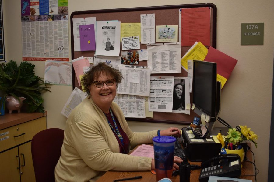 Nancy Obrien, the school nurse, catches up on some paperwork after taking care of sick or injured students of the day.