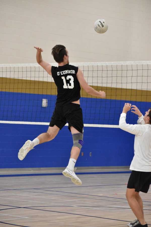 Jared White, senior, attempts to make contact with the ball at practice. 