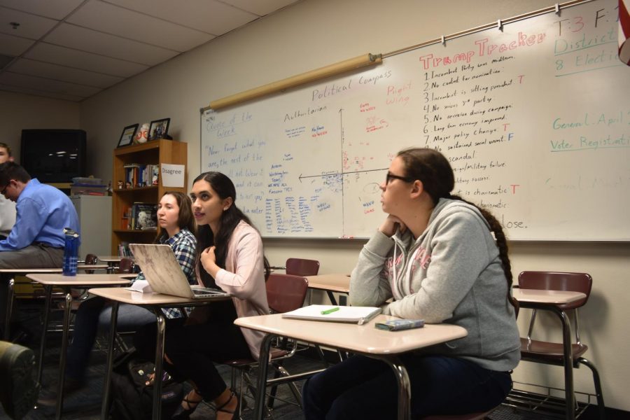 (Left to right) Rebecca Felton, senior, Swathi Ramukar, senior, and Talise Brown, freshman, attending a Model UN meeting.