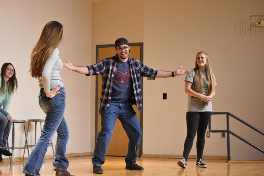 (Left to right seniors) Olivia Hsu, Nicholas Leach, and Mandy Moisoff act out their skit prompt with gusto. 