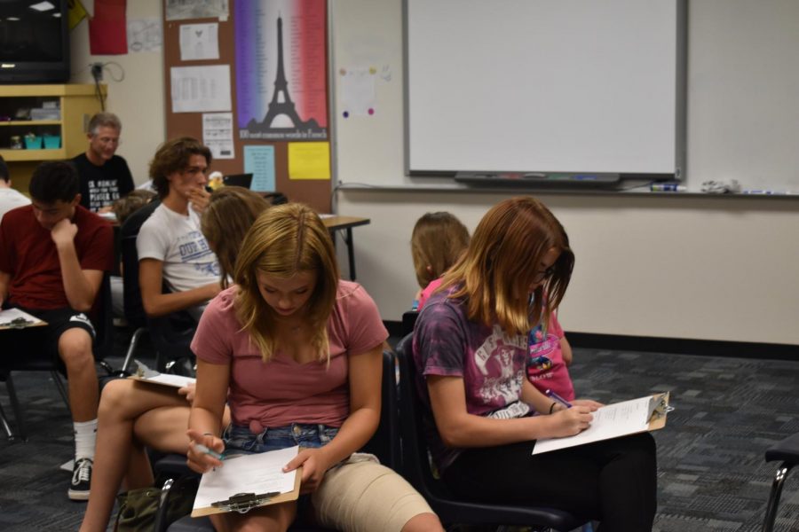 Mr.Candela, French teacher, uses the empty classroom to his advantage during testing.