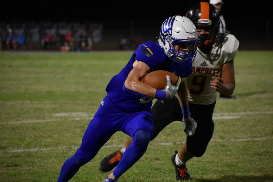 OHS receiver, Tyler Bergstrom (senior) is tackled by JCHS linebacker, Jeremiah Tauai (junior).