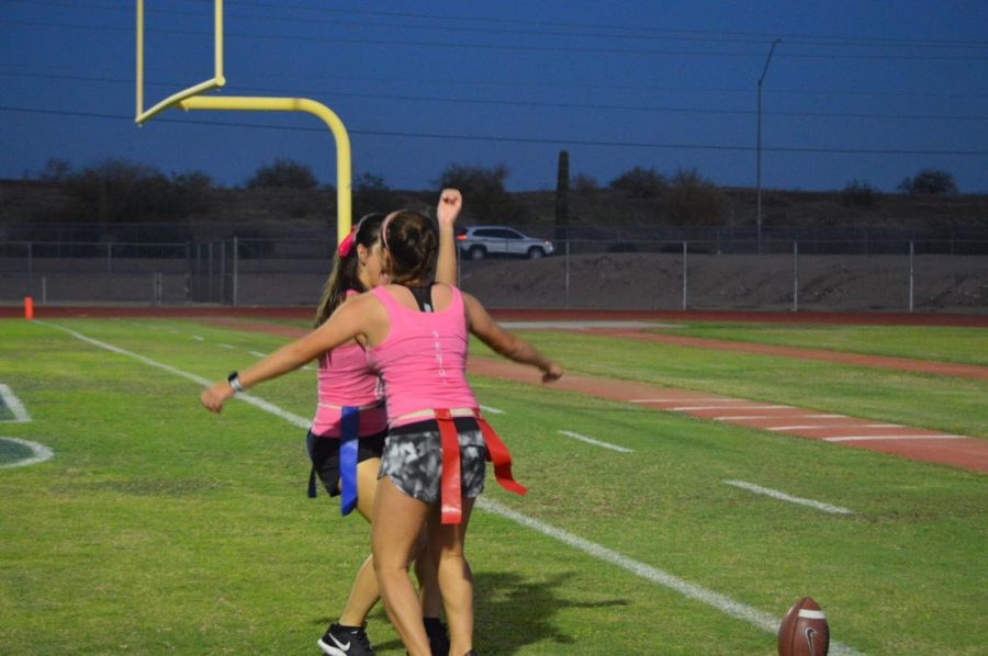 Seniors chest bump to a victorious touchdown made against the juniors.
