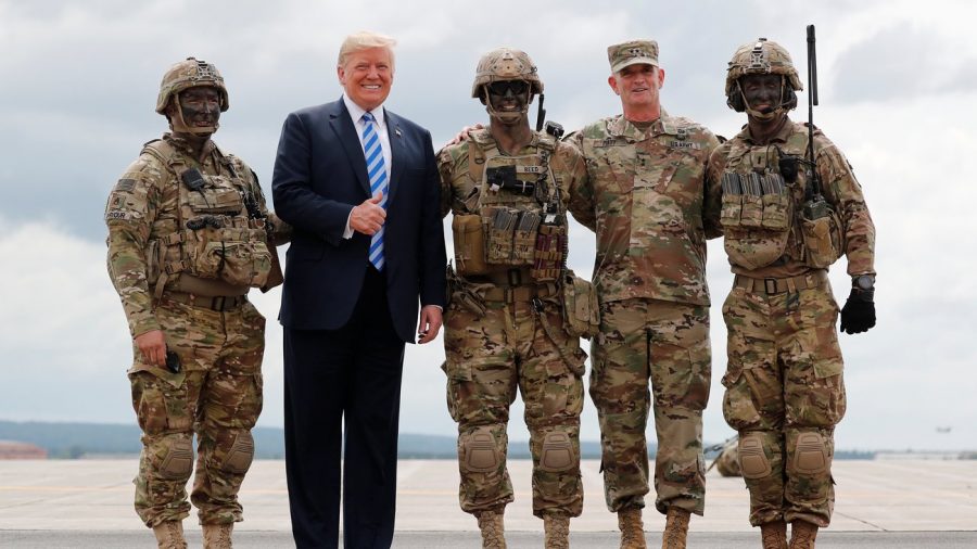 Donald Trump, pictured second to left, ordered 5200 new border troops to patrol the border in the wake of a caravan of Guatemalan migrants.