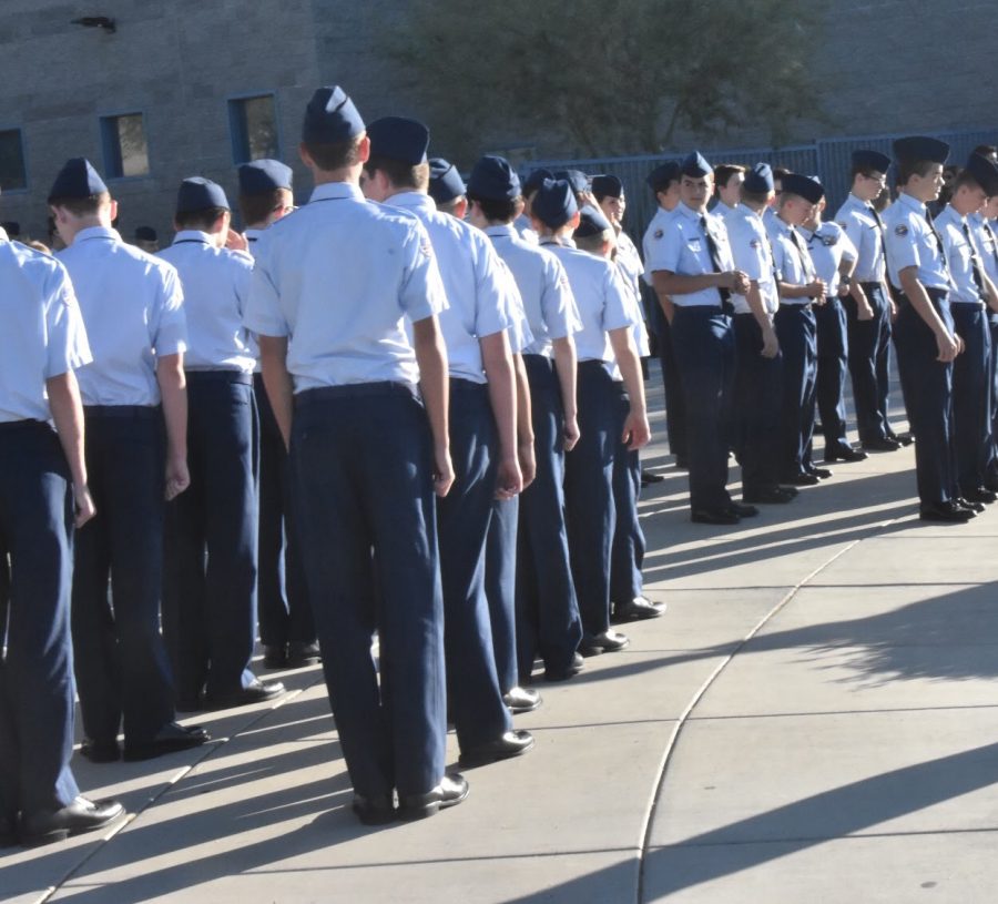 ROTC greets students as they enter school.