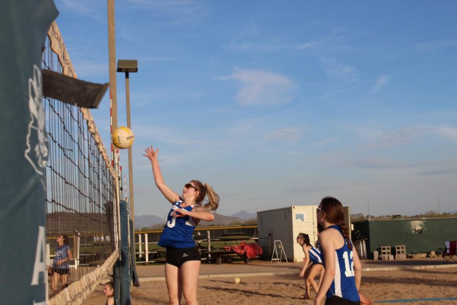 Ally Fuller, senior, helps her team by scoring points during her match.