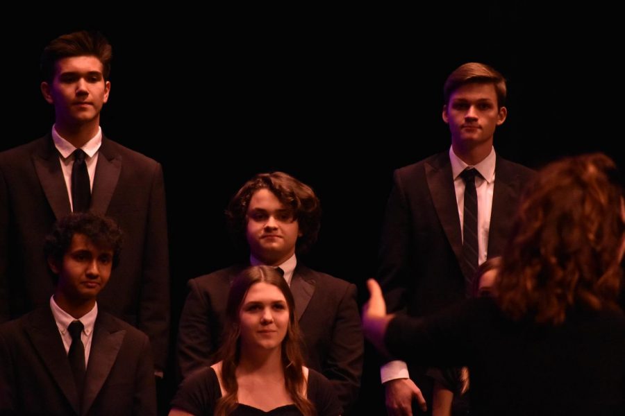 Conductor, Anna Backstrom, leads the choir through the concert.