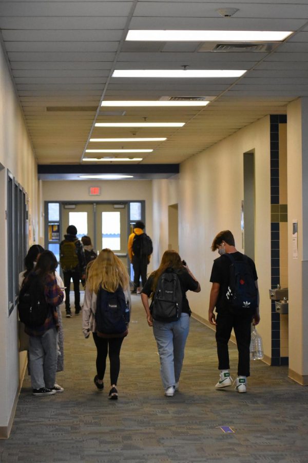 Students head to class on a new bell schedule.