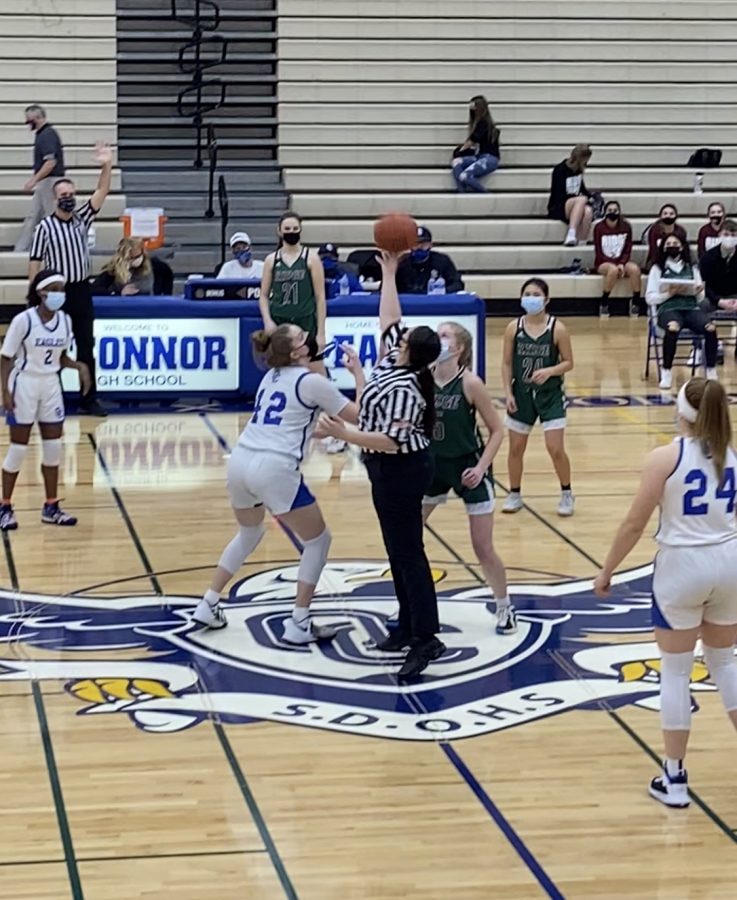 OC girls basketball in a tipoff in ridge rivalry game