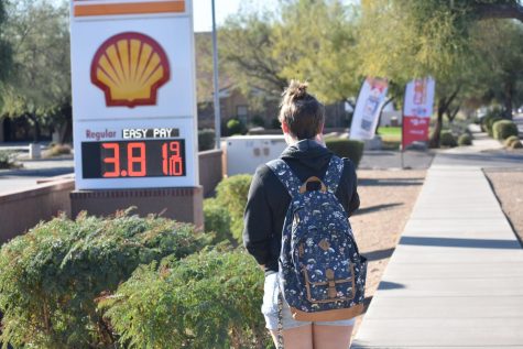 An OHS student observes the rising cost of gas.