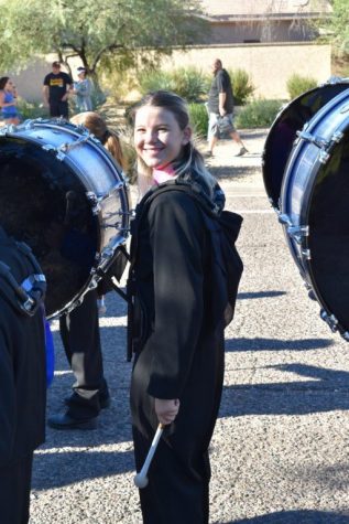 Claire Cipolla, junior, smiles during the homecoming parade.