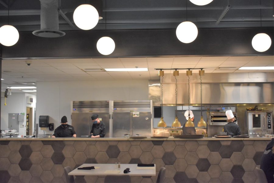 Patrons of Avenue 27 see their food being cooked in the appealing restaurant space.