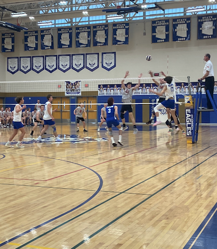 The OHS boys volleyball team in action against Liberty High School.