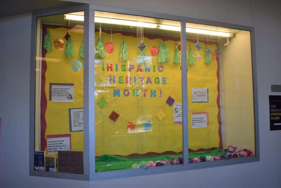 Display case shows crafts from different aspects of Hispanic culture.