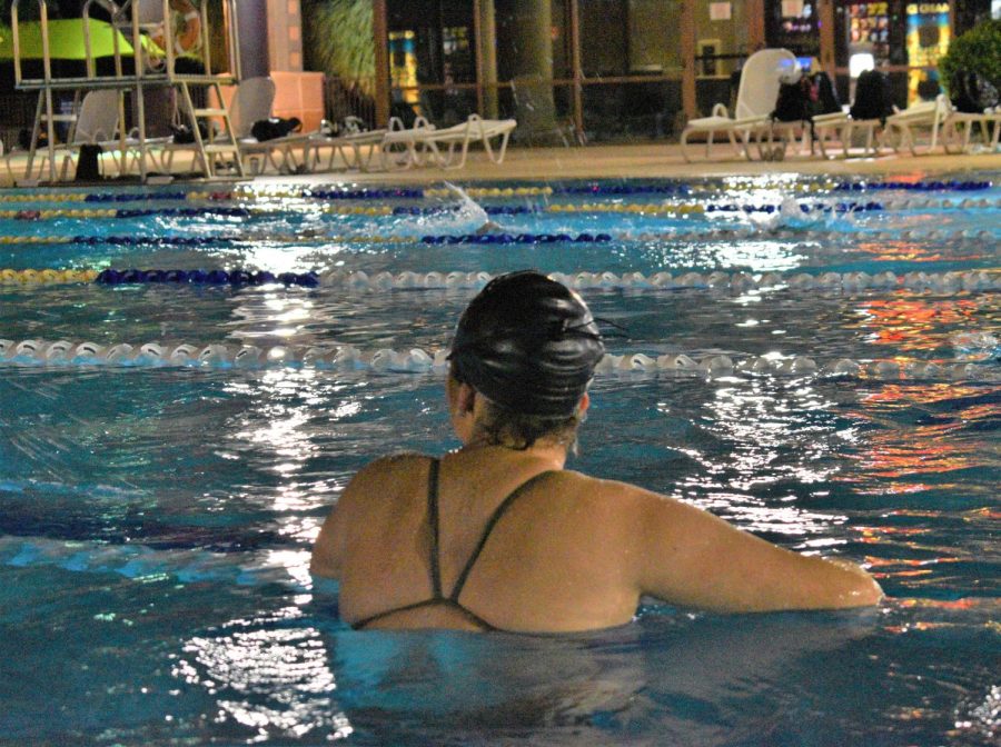 Roslyn Jefferies, senior, takes a break during a rigorous swim practice.