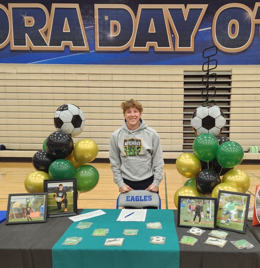 Brayden Perry, senior, celebrates as he signs to play collegiate soccer at Paradise Valley Community College.