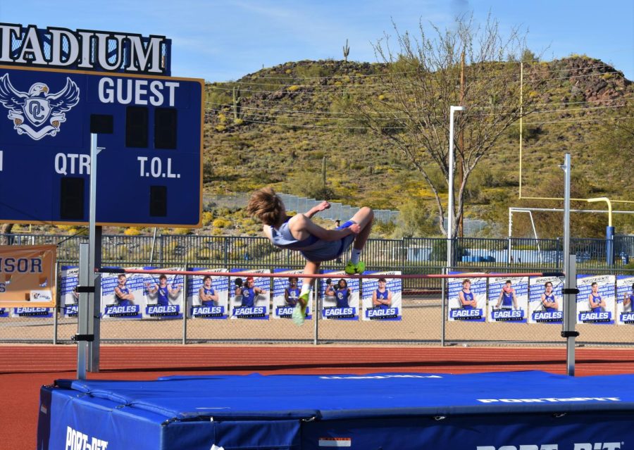 OHS track athlete jumps for success.