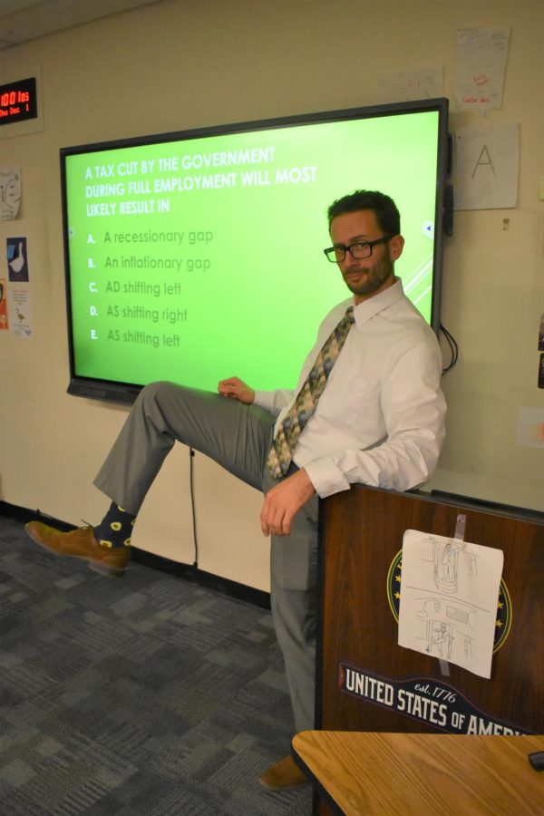 Richard Weyker, social studies teacher, shows off his avocado socks.